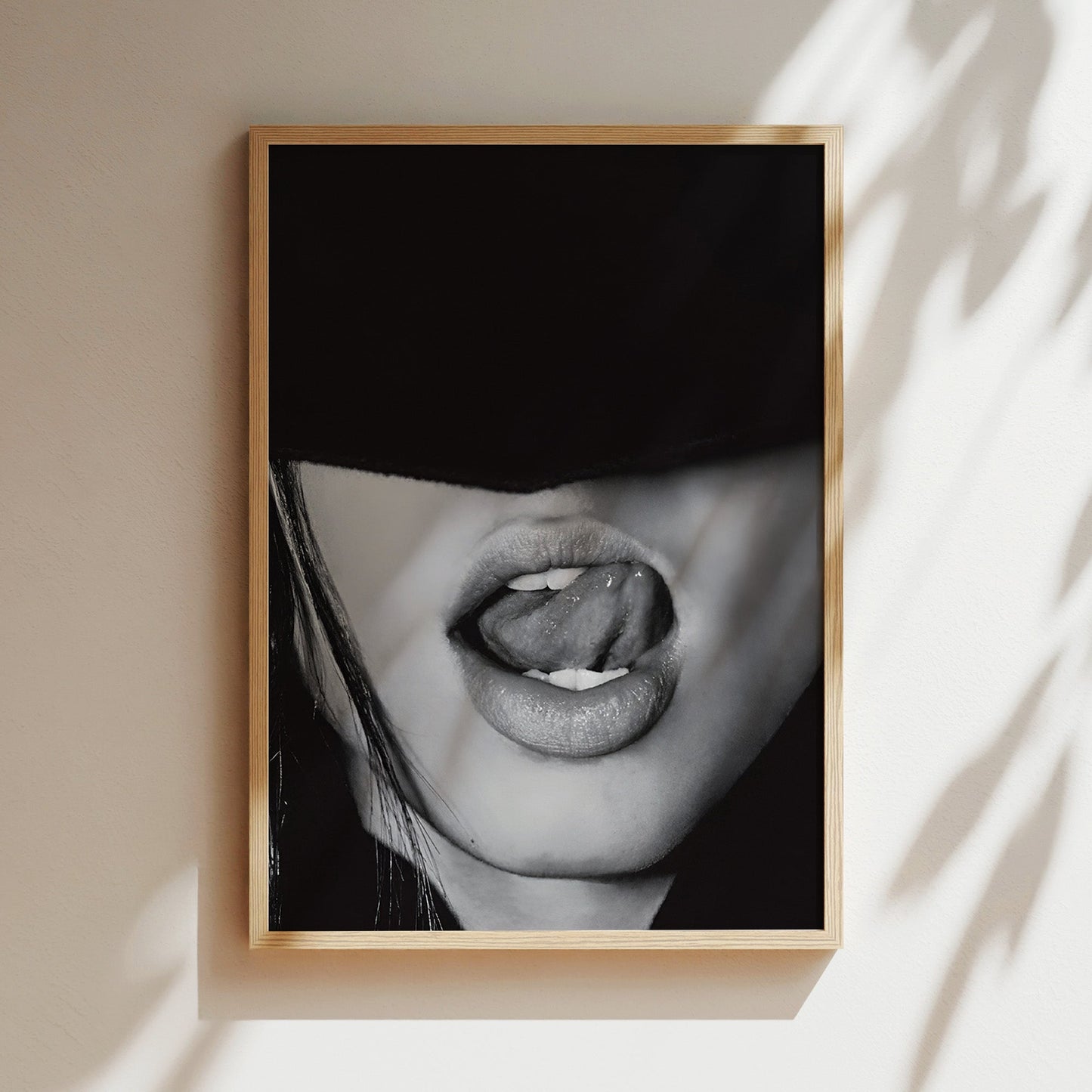 Classic wooden frame featuring a moody, cropped close-up of glossy lips and exposed teeth in a provocative pose.