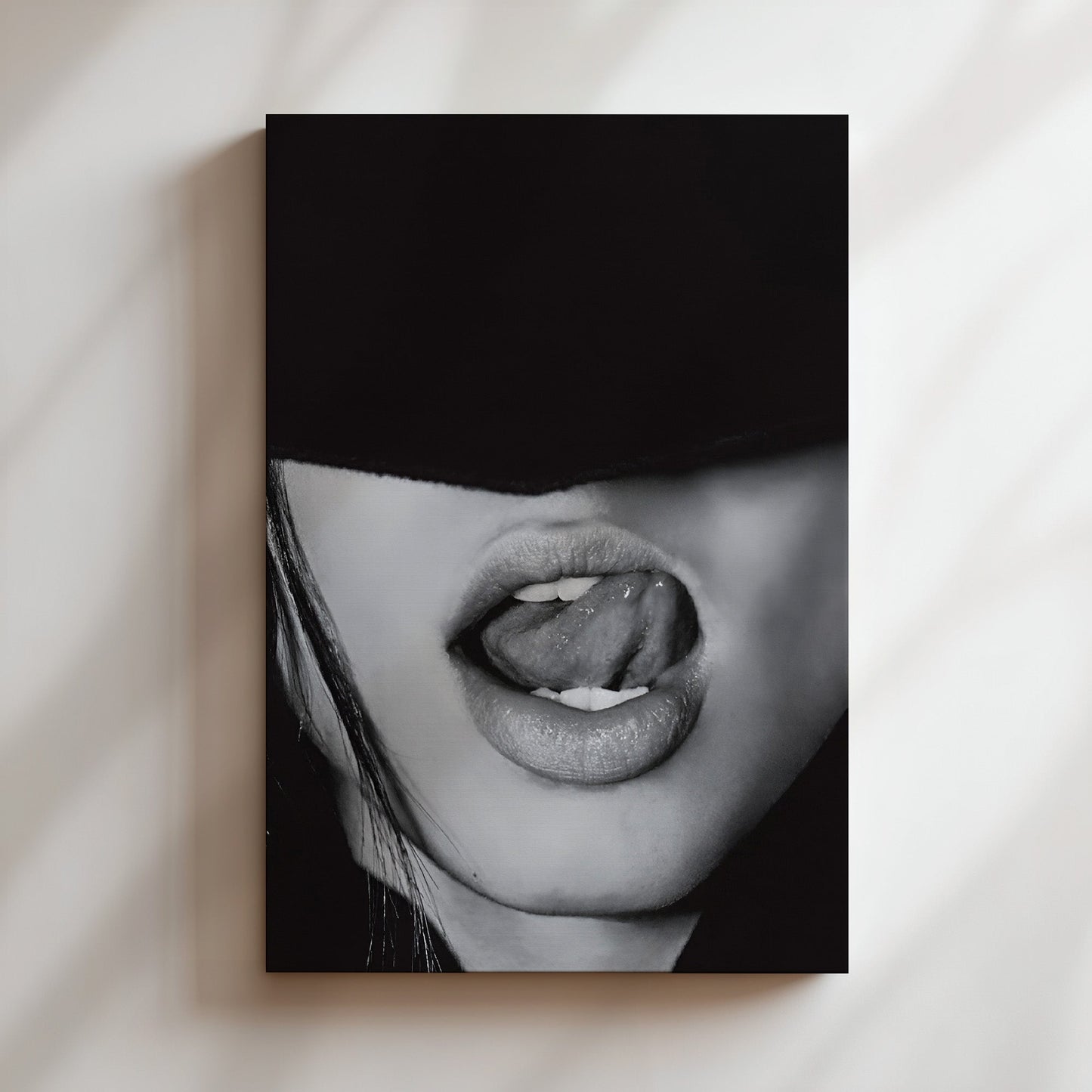 Mounted canvas print of a monochrome lips image, styled with edgy and seductive minimalism on a gallery-style wall.