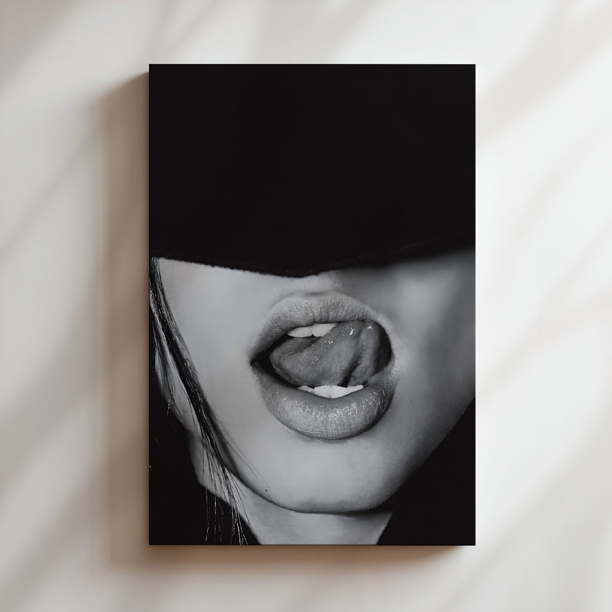 Mounted canvas print of a monochrome lips image, styled with edgy and seductive minimalism on a gallery-style wall.